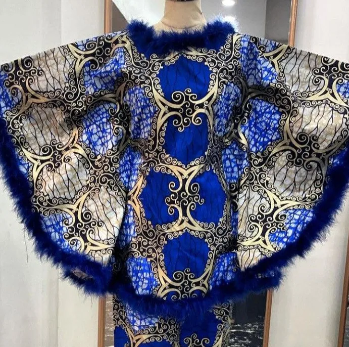 A royal-blue and gold Ankara cape, hand-finished